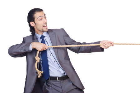 Businessman pulling rope on white
