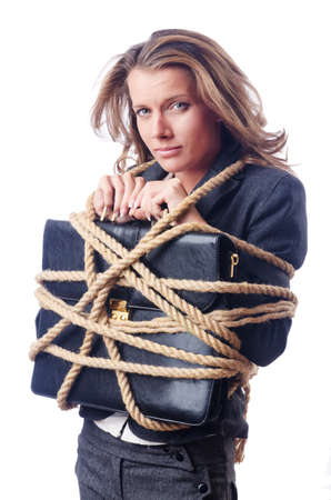 Businesswoman tied with rope on whiteの写真素材