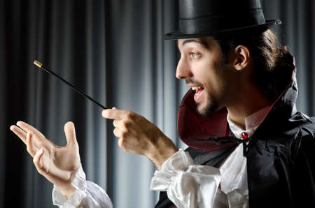 Magician doing tricks on whiteの写真素材