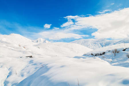 Snow mountains on bright winter dayの写真素材