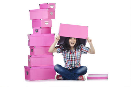 Girl with lots of gifts on whiteの写真素材