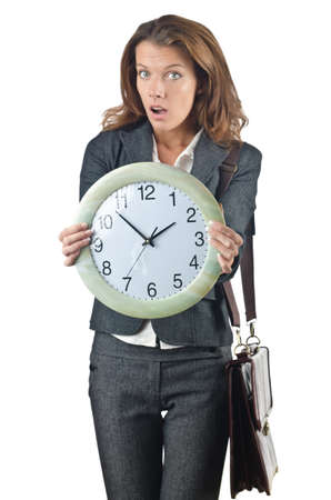 Businesswoman with clock isolated on whiteの写真素材
