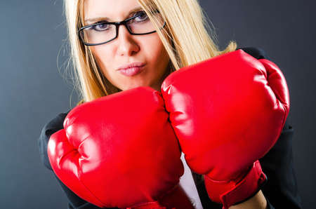 Woman boxer in dark roomの写真素材