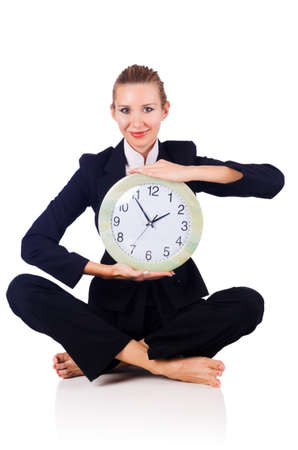 Woman with clock on whiteの写真素材