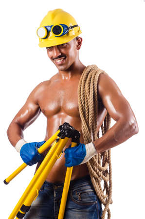 Muscular builder with tools isolated on whiteの写真素材