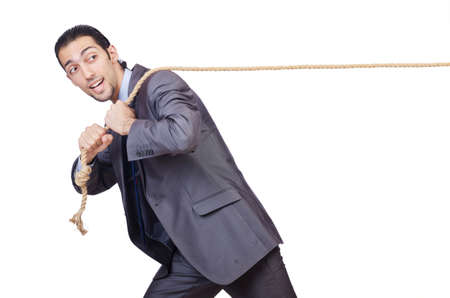 Businessman pulling rope on whiteの写真素材