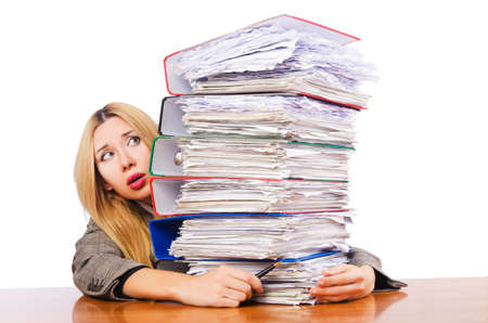 Busy woman with stacks of paperの写真素材