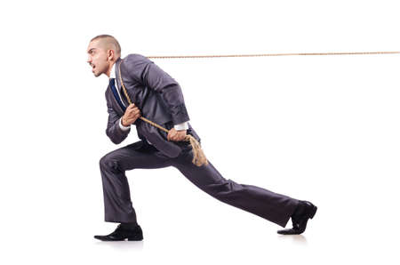 Man in tug of war concept on whiteの写真素材