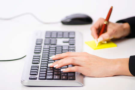 Hands working on the keyboardの写真素材
