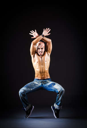 Dancer dancing in dark roomの写真素材