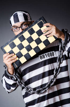Convict criminal in striped uniformの写真素材