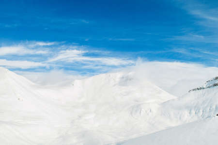 Snow mountains on bright winter day