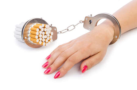Addition concept with cigarettes and handcuffsの写真素材