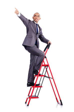 Businessman with the ladder isolated on whiteの写真素材