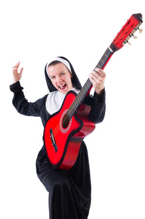Nun playing guitar isolated on whiteの写真素材
