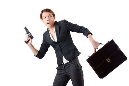 Woman businewoman with hand gunの写真素材