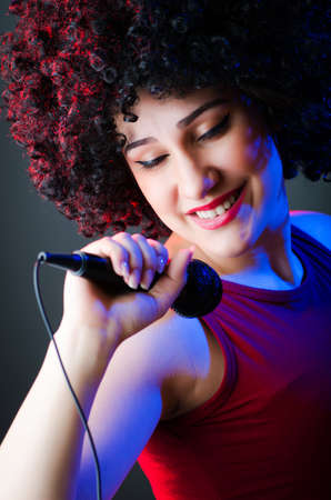 Female performer at disco with micの写真素材