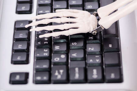 Skeleton working on the keyboardの写真素材