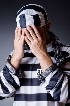 Convict criminal in striped uniformの写真素材