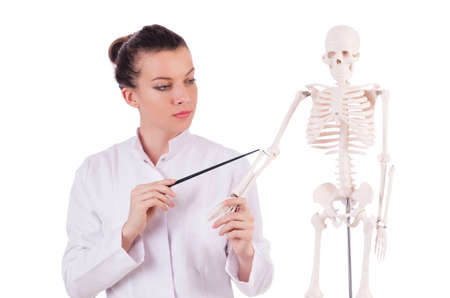 Doctor with skeleton on white