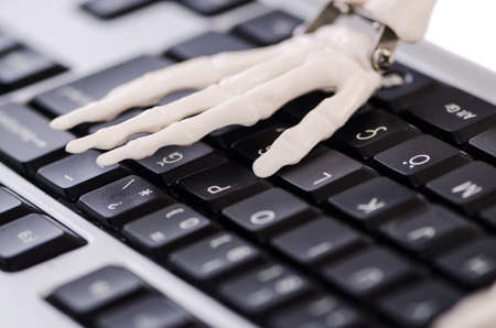 Skeleton working on the keyboardの写真素材