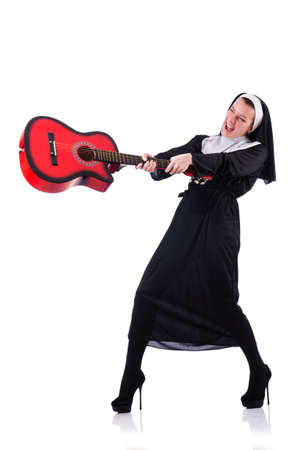 Nun playing guitar isolated on whiteの写真素材