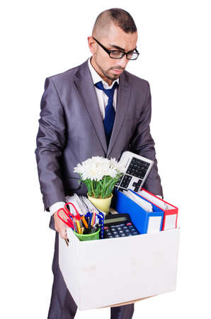 Man being fired with box of personal stuffの写真素材