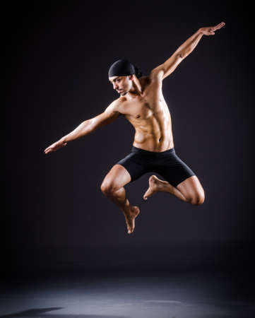 Dancer dancing in the dark studioの写真素材