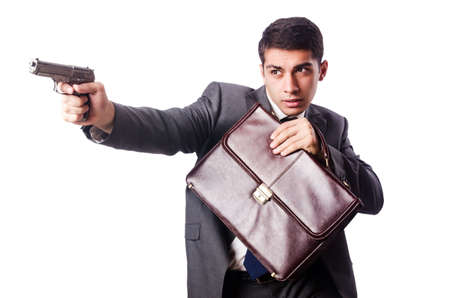 Businessman with gun isolated on whiteの写真素材
