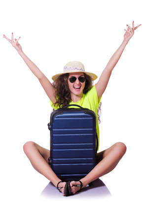 Young woman with suitcase on whiteの写真素材
