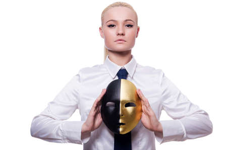Woman with mask in hypocrisy conceptの写真素材