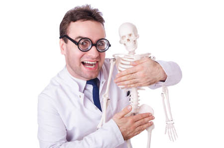Funny doctor with skeleton isolated on whiteの写真素材