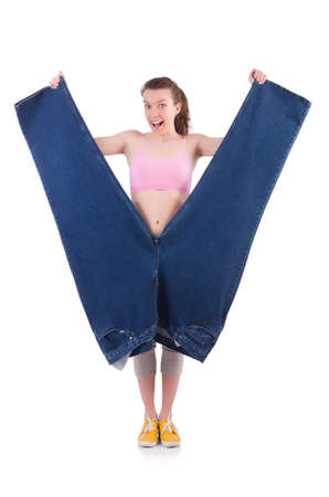 Woman in dieting concept with big jeansの写真素材
