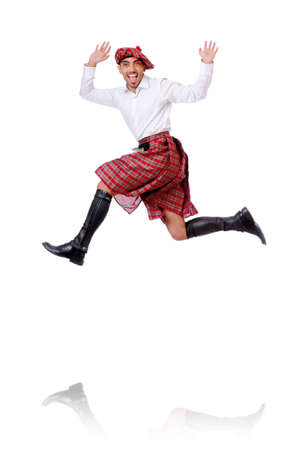 Scottish man dancing on whiteの写真素材
