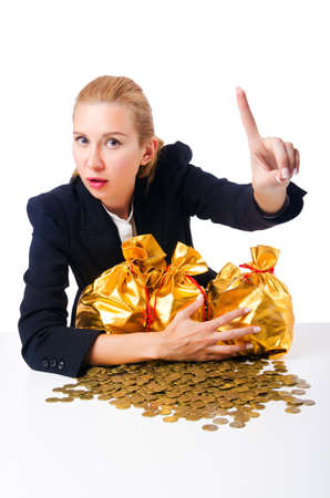 Woman with coins isolated on whiteの写真素材