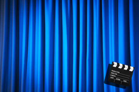Movie clapper board against curtainの写真素材