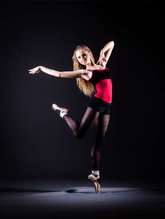 Ballerina dancing in the dark studioの写真素材
