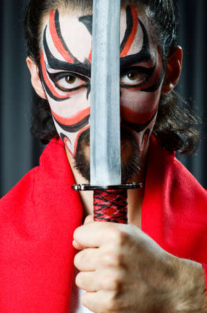 Man with sword and face maskの写真素材