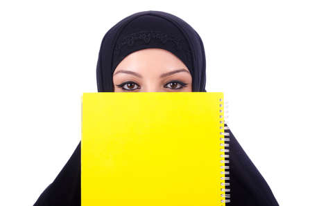 Young muslim woman with book on whiteの写真素材