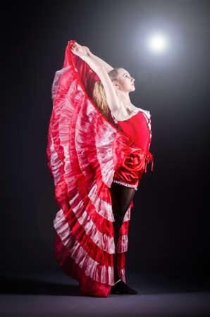 Girl in red dress dancing danceの写真素材