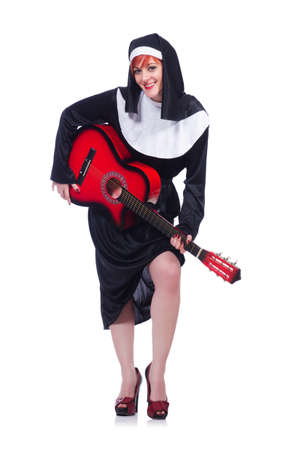 Nun playing guitar isolated on whiteの写真素材