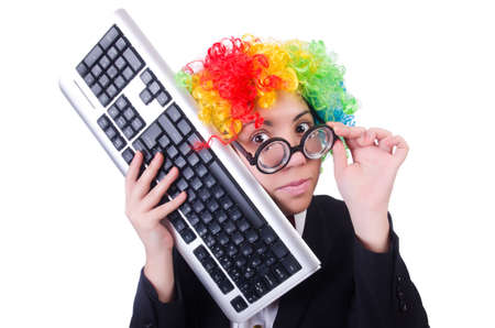 Funny clown with keyboard on whiteの写真素材