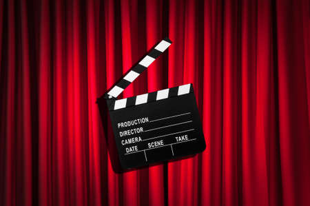 Movie clapper board against curtainの写真素材