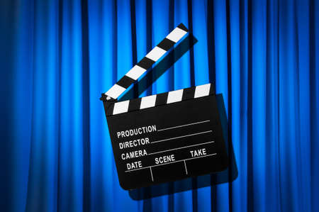 Movie clapper board against curtainの写真素材