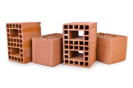 Stack of clay bricks isolated on white