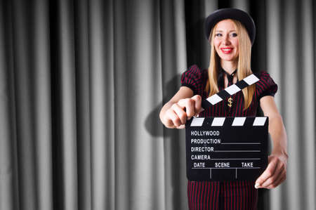 Woman gangster with movie clapperの写真素材