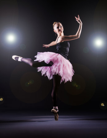 Ballerina dancing in the dark studioの写真素材