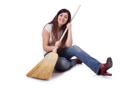 Young woman with broom isolated on whiteの写真素材