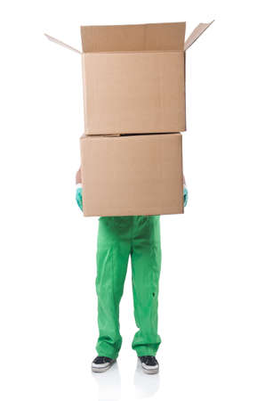 Man in green coveralls with boxesの写真素材