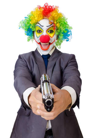 Businessman clown with gun isolated on whiteの写真素材